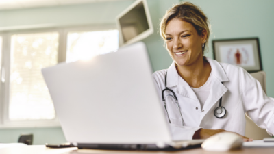 Smiling doctor in lab coat.
