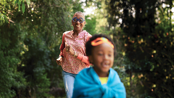 Boy and grandmother running together, representing quality of life after comprehensive AF management.