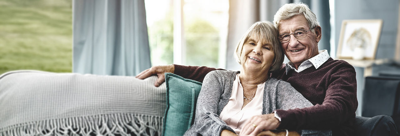 Smiling couple, referring to Patient stories.