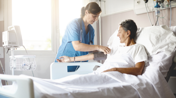 Nurse assisting a patient in the hospital